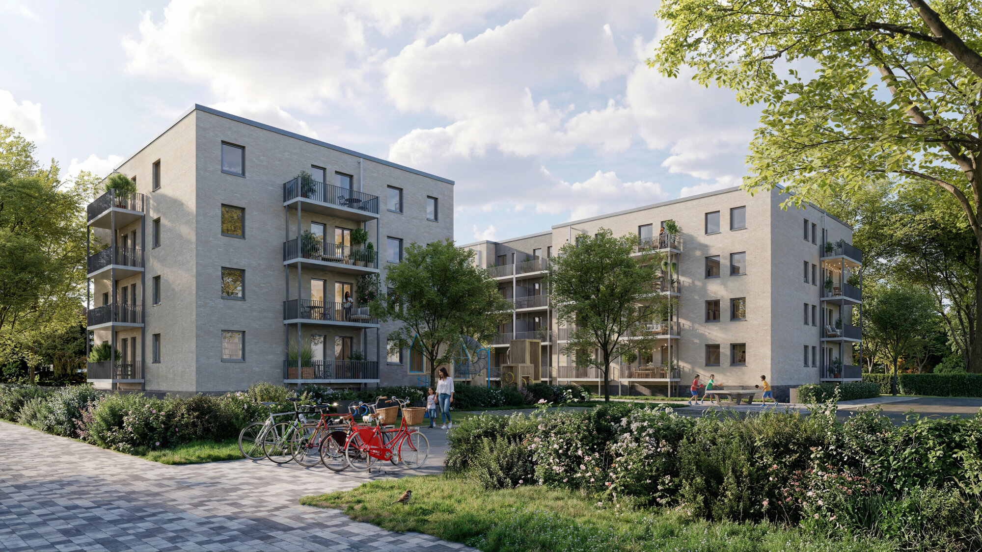 Mehrgeschossige moderne Wohnanlage mit Balkonen, begrüntem Innenhof, Spielplatz, Fahrrädern und mehreren Menschen auf Wegen und im Außenbereich.